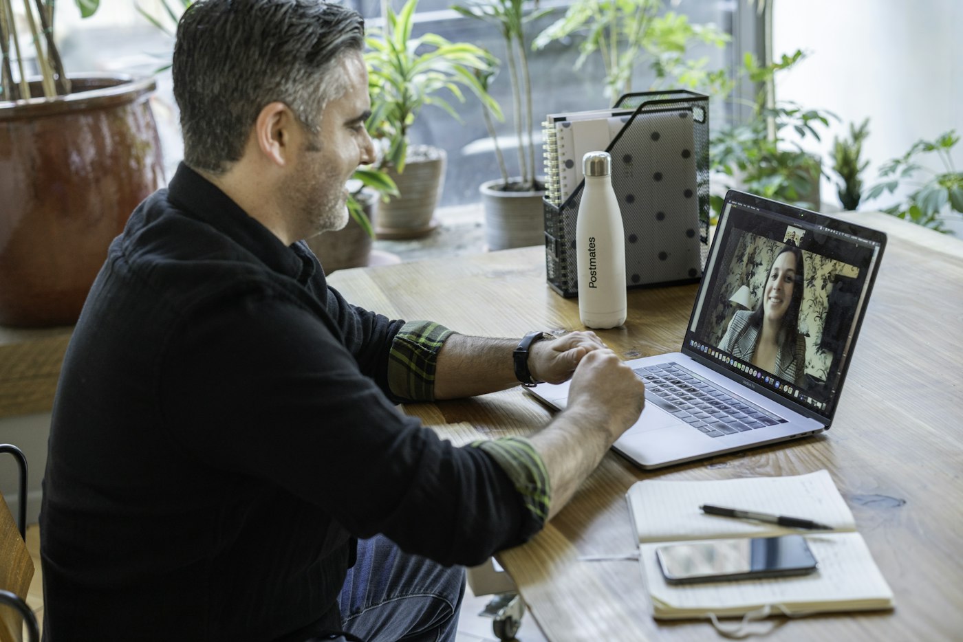A man at home on a video call with his doctor on his laptop.